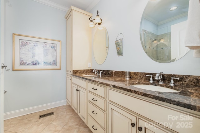 full bathroom with crown molding, a stall shower, visible vents, and a sink