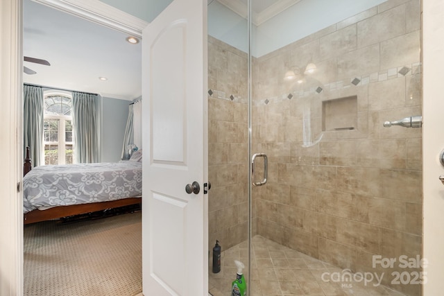 ensuite bathroom featuring connected bathroom, a stall shower, and crown molding