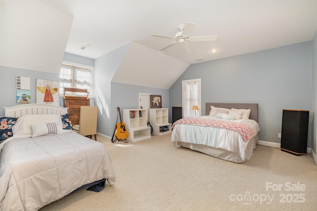 bedroom with a ceiling fan, carpet, baseboards, visible vents, and lofted ceiling