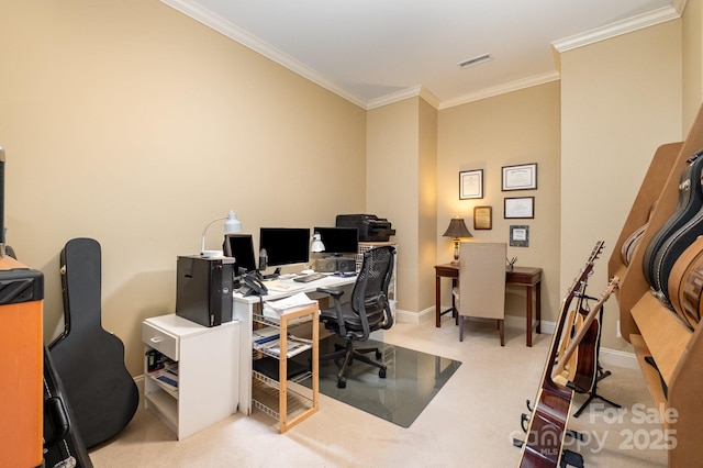 office space featuring visible vents, baseboards, carpet, and ornamental molding