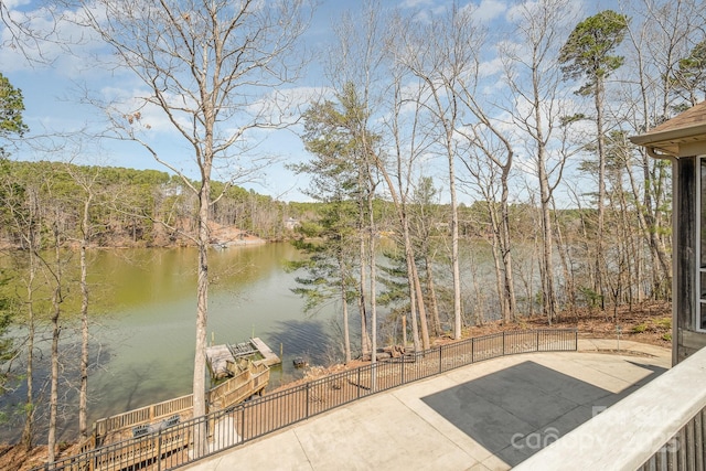 property view of water featuring a wooded view