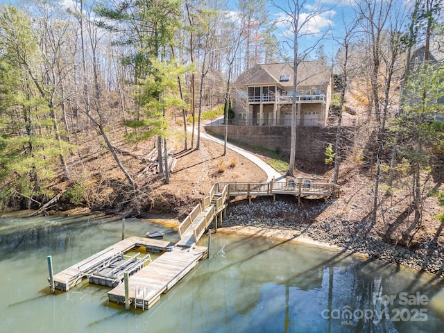 dock area with a water view