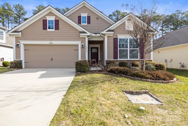 craftsman-style house featuring stone siding, a front yard, concrete driveway, and a garage