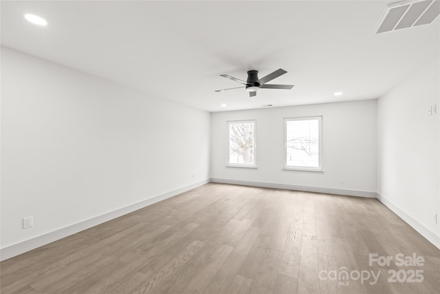 unfurnished room with recessed lighting, a ceiling fan, baseboards, visible vents, and light wood-style floors