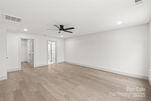 spare room featuring recessed lighting, visible vents, light wood-style floors, a ceiling fan, and baseboards