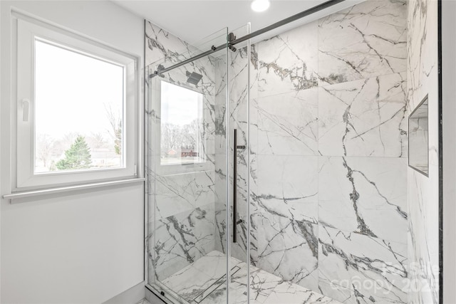 full bath featuring a marble finish shower