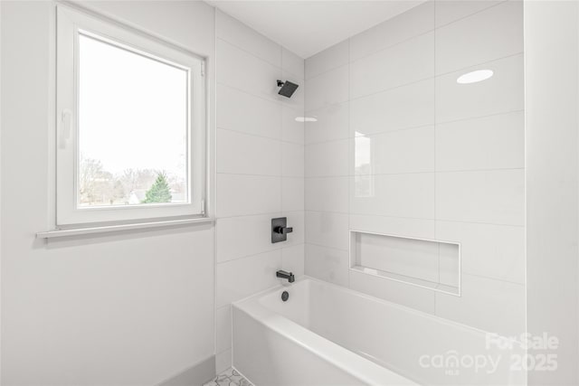 bathroom with shower / tub combination