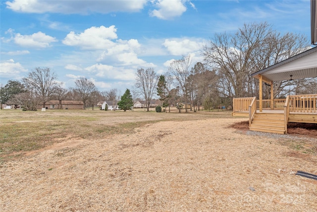 view of yard featuring a wooden deck