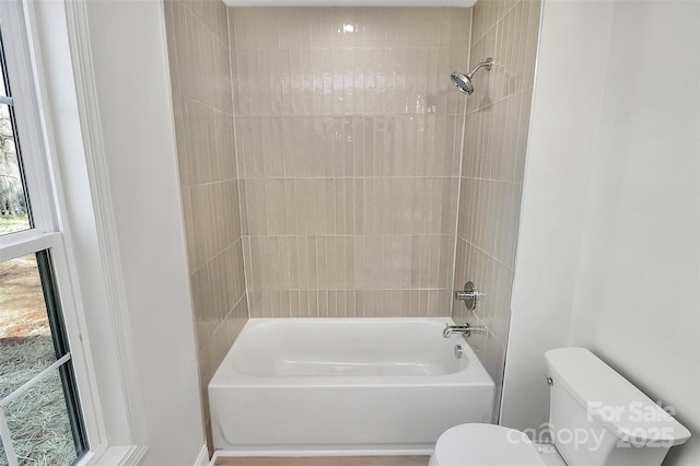 full bathroom with bathtub / shower combination and toilet