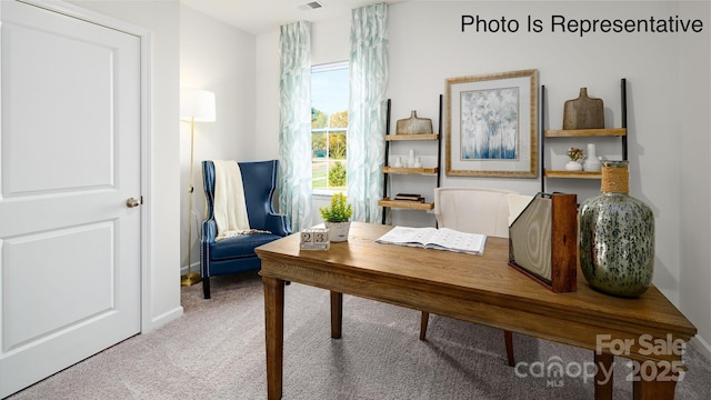 office featuring carpet flooring, visible vents, and baseboards