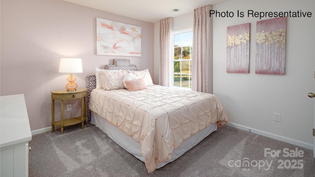 bedroom with carpet flooring, visible vents, and baseboards