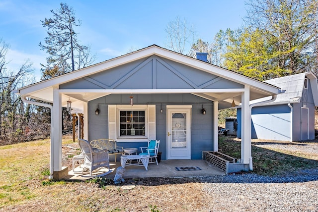 view of front of property with a porch and concrete block siding