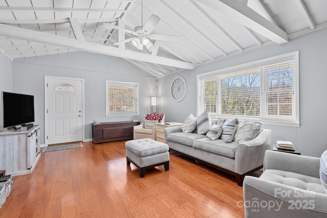 living area with lofted ceiling with beams, light wood-type flooring, and a ceiling fan