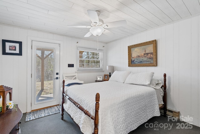 carpeted bedroom featuring access to outside and a ceiling fan