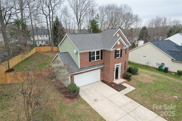 traditional home featuring fence, a front yard, a shingled roof, an attached garage, and brick siding