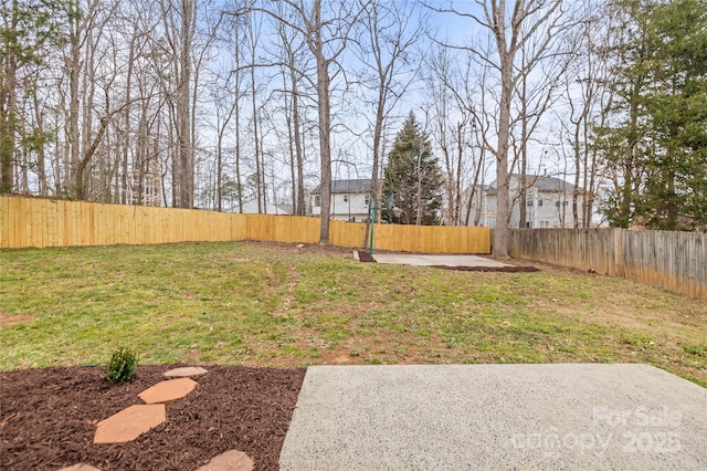 view of yard with a fenced backyard