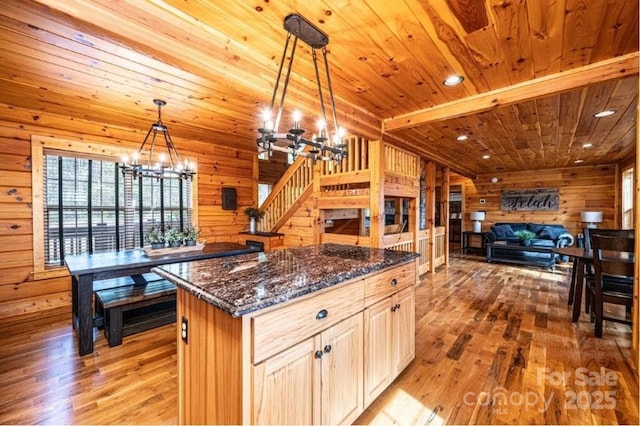 kitchen with wooden ceiling, a notable chandelier, wood walls, open floor plan, and light wood-type flooring