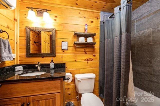 bathroom featuring shower / bath combo, vanity, toilet, and wooden walls