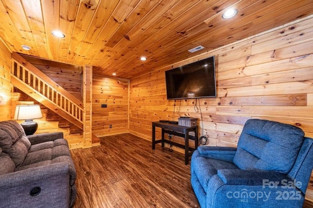 living room with stairs, wooden ceiling, wood walls, and wood finished floors