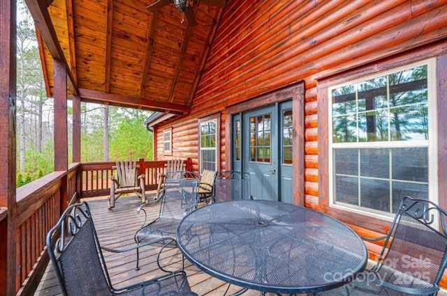 wooden deck featuring outdoor dining space