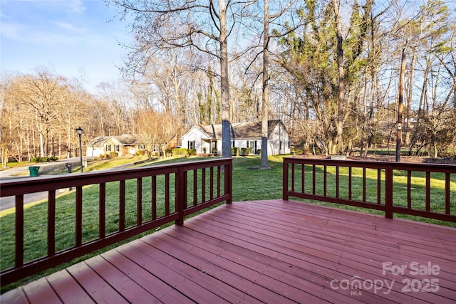 wooden deck with a yard and a residential view