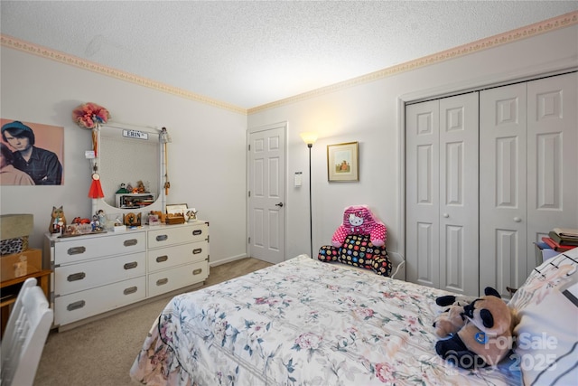 bedroom featuring carpet floors, a closet, and a textured ceiling