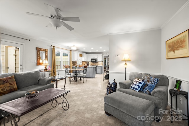 living area featuring ceiling fan, recessed lighting, light colored carpet, and crown molding