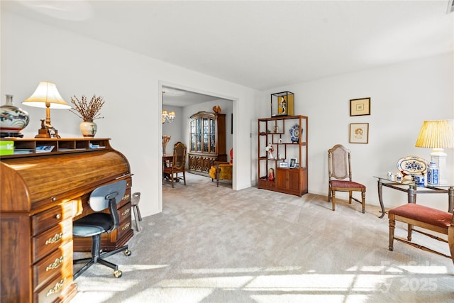 office area featuring carpet flooring, visible vents, and an inviting chandelier