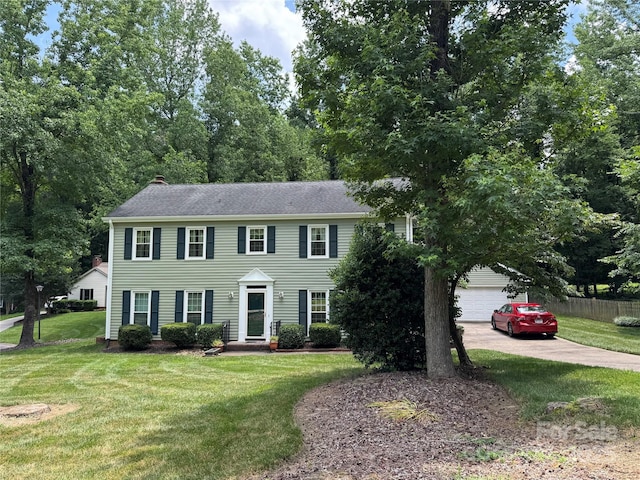 1919 Windlock Dr, Charlotte, NC 28270 - colonial house featuring concrete driveway, a garage, a chimney, and a shingled roof