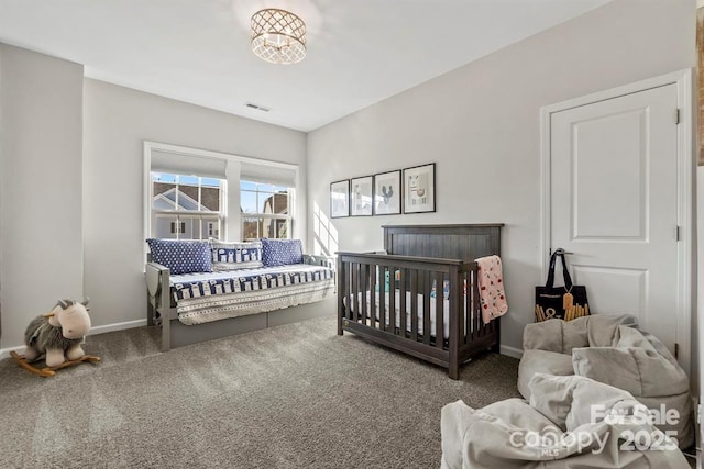 bedroom with carpet floors, visible vents, and baseboards