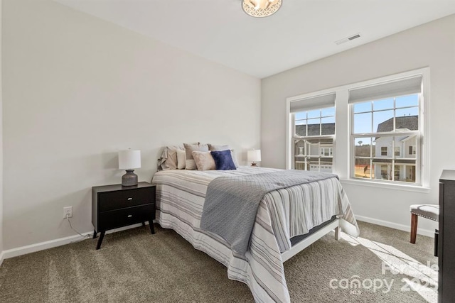 bedroom featuring carpet, visible vents, and baseboards