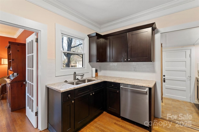 kitchen with decorative backsplash, dishwasher, crown molding, light wood-type flooring, and a sink