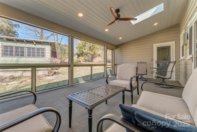 sunroom featuring vaulted ceiling with skylight, wooden ceiling, and ceiling fan