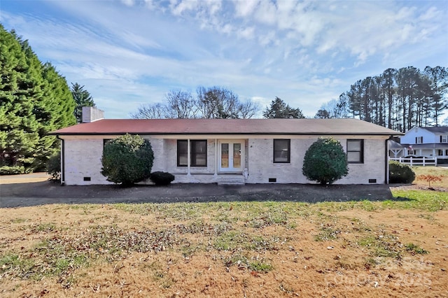 single story home with crawl space, a chimney, and french doors