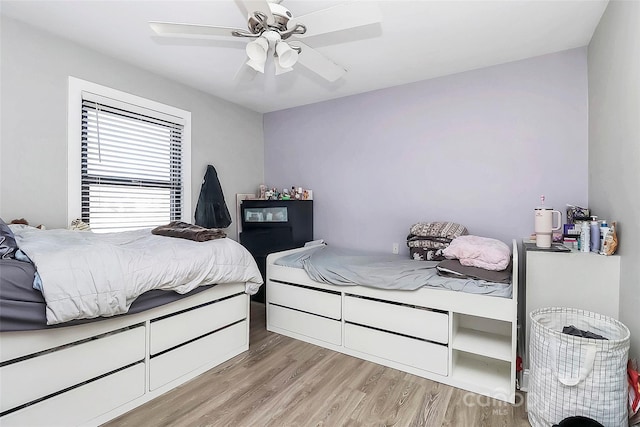 bedroom featuring light wood-type flooring and ceiling fan