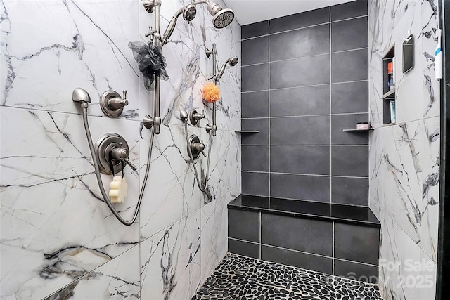 9808 Washam Potts Rd, Cornelius, NC 28031 - bathroom featuring tiled shower and marble look tiles