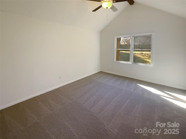 empty room featuring high vaulted ceiling, dark colored carpet, baseboards, and a ceiling fan