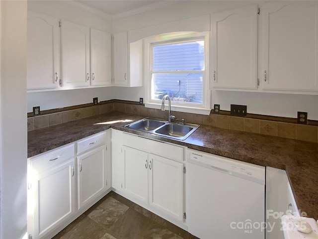 kitchen featuring dark countertops, white cabinetry, a sink, and dishwasher