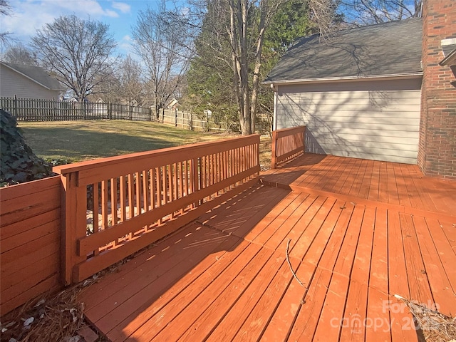 wooden deck with a fenced backyard and a yard