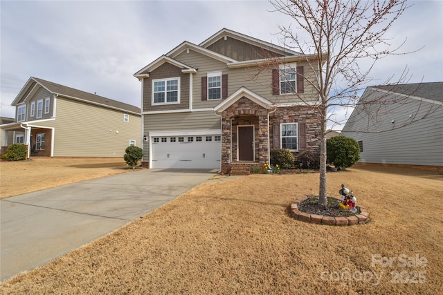 craftsman-style home featuring an attached garage, driveway, and stone siding