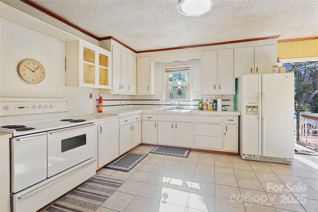 kitchen featuring white appliances, light countertops, crown molding, and white cabinets