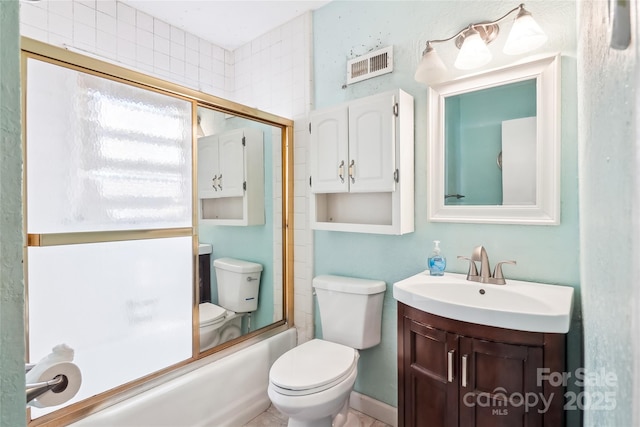 bathroom featuring toilet, enclosed tub / shower combo, visible vents, and vanity