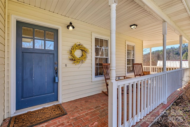 doorway to property featuring a porch