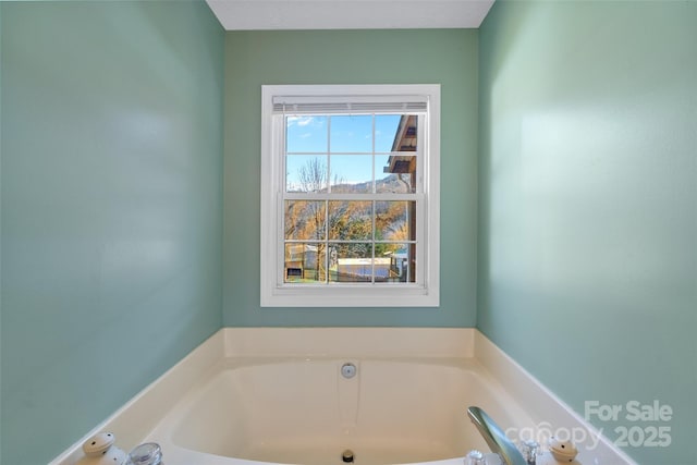 bathroom with a garden tub