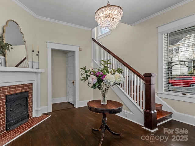 entrance foyer featuring crown molding, stairs, and wood finished floors