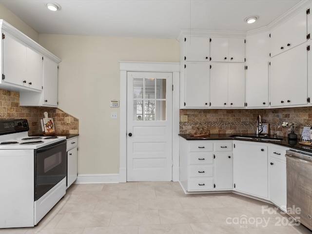 kitchen featuring dark countertops, electric range, white cabinets, a sink, and dishwasher