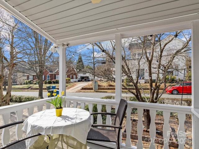 balcony with a residential view and a porch