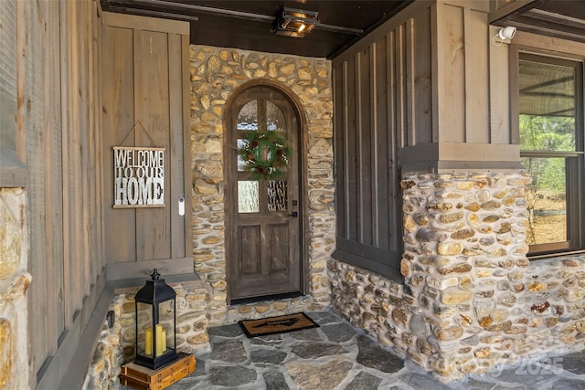 view of exterior entry with stone siding