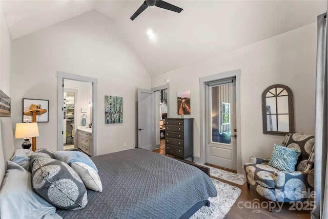 bedroom with a ceiling fan, high vaulted ceiling, wood finished floors, and ensuite bathroom