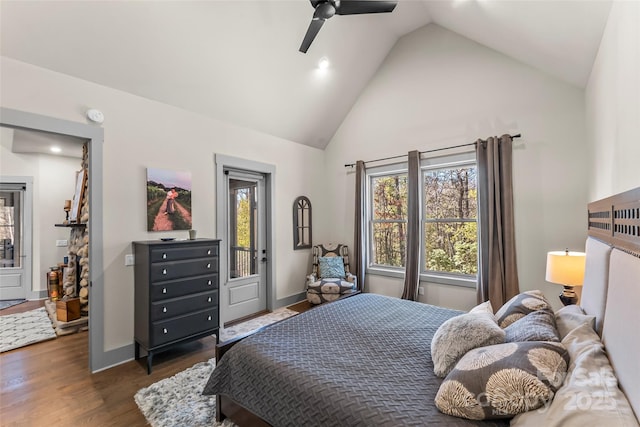 bedroom featuring dark wood-style floors, high vaulted ceiling, ceiling fan, and baseboards